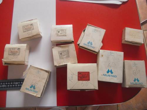 APPROXIMATELY 900 HOOKS (NEVER BEEN USED).